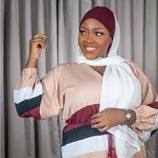 Elegant light pink veil draped on a mannequin
